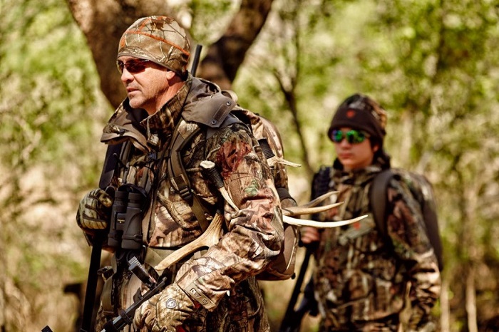father and son on hunting with full hunting gear