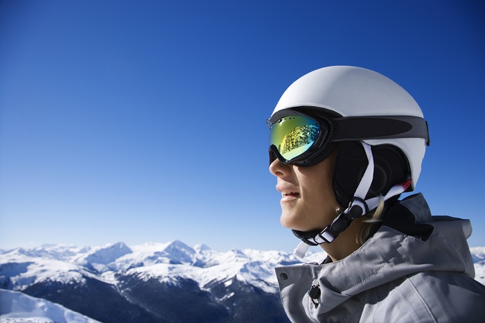 man wearing a snowboard helmet and goggles 