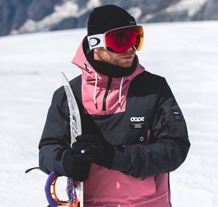 man wearing snowboard gear including gloves 