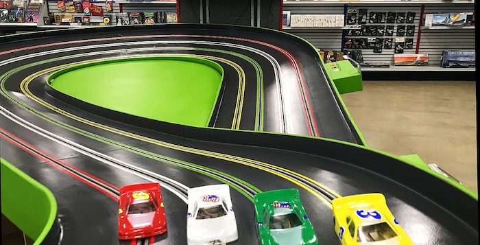 Four cars on slot track