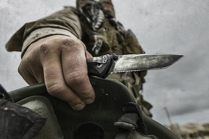 army man holding an army knife