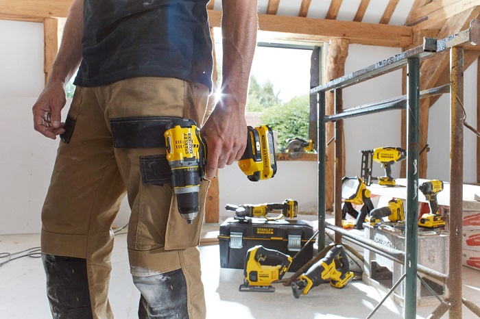construction worker in a room full of power tools